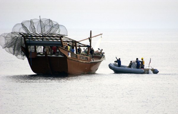 This US Navy handout image from April 2004 shows a team assigned to USS Bulkeley approaching a dhow in the Arabian Gulf while conducting maritime operations aimed at fighting the global war on terrorism. [HO/US NAVY/AFP]