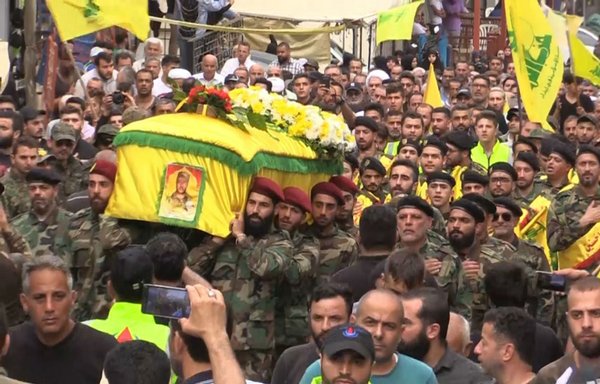 Lebanese Hizbullah members are pictured at a funeral for one of the party's fighters killed in Syria in a photo posted online May 10th, 2018. [Photo courtesy of The Martyrs Foundation]