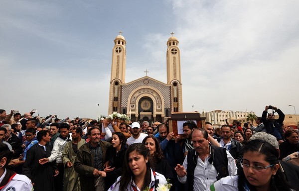 Mourners carry the coffin of one of the victims of the blast at the Coptic Christian Saint Mark's church in Alexandria the previous day during a funeral procession at the Monastery of Mar Mina in the city of Borg El-Arab, east of Alexandria on April 10th, 2017. [Mohamed al-Shahed/AFP]