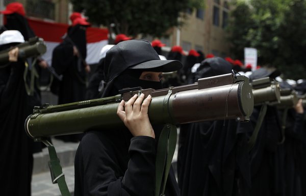 In this file photo taken September 6th, 2016, Yemeni female fighters supporting the Iran-backed Houthis hold rocket launchers during an anti-Saudi rally in Sanaa. [Mohammed Huwais/AFP] 