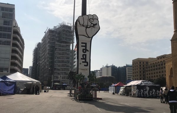 The large fist towering over Beirut's Martyrs' Square has become a symbol of the protests that erupted in Lebanon on October 17th. [Nohad Topalian/Al-Mashareq]   
