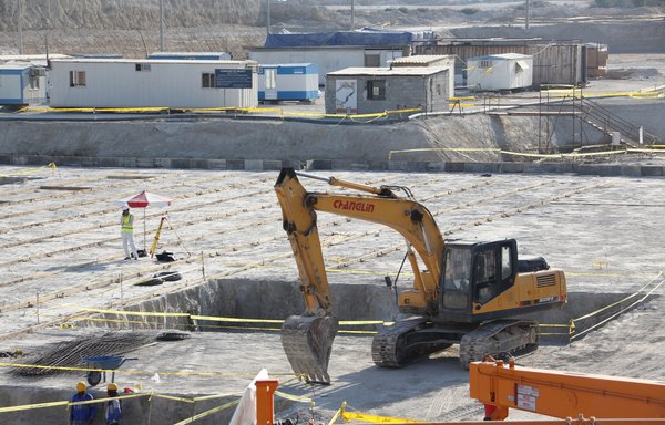 A picture taken November 10th, 2019, shows an excavator on a construction site in Iran's Bushehr nuclear power plant, during an official ceremony to kick-start works for a second reactor at the facility. Bushehr is Iran's only nuclear power station and is currently running on imported fuel from Russia that is closely monitored by the UN's International Atomic Energy Agency. [Atta Kenare/AFP]