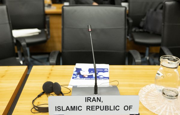 An empty chair of Iran's ambassador to International Atomic Energy Agency is seen at the opening of the agency's board meeting at its headquarters in Vienna on March 9th. [Joe Klamar/AFP]
