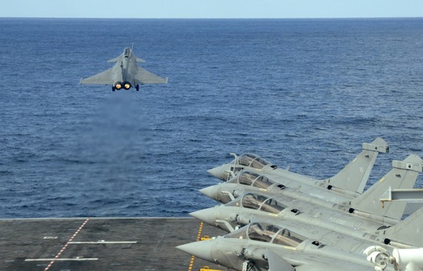 A French Rafale fighter jet is catapulted from the French aircraft carrier, Charles de Gaulle, off the eastern coast of Cyprus in the Mediterranean Sea on February 10th. The French aircraft carrier is engaged in operations against ISIS as part of Opération Chammal, the French component of the anti-ISIS coalition, in the eastern Mediterranean sea. [Mario Goldman/AFP]