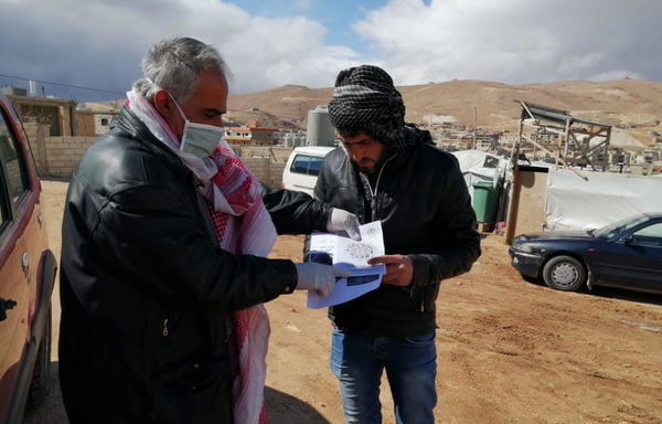 The Voice of Syrian Refugees in Lebanon committee launched an awareness campaign about COVID-19 prevention in the Arsal camps, and distributed instructional pamphlets provided by the Lebanese army. [Photo courtesy of Voice of Syrian Refugees in Lebanon]