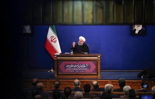 Iranian President Hassan Rouhani speaks during a news conference in Tehran on February 16th. [Atta Kenare/AFP]