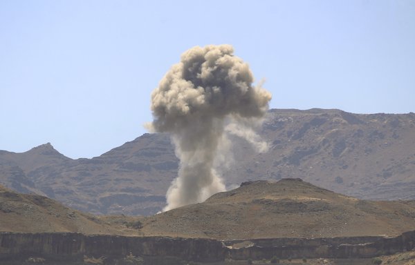 In this file photo taken February 23rd, smoke billows following an Arab coalition airstrike in Sanaa. [Mohammed Huwais/AFP]