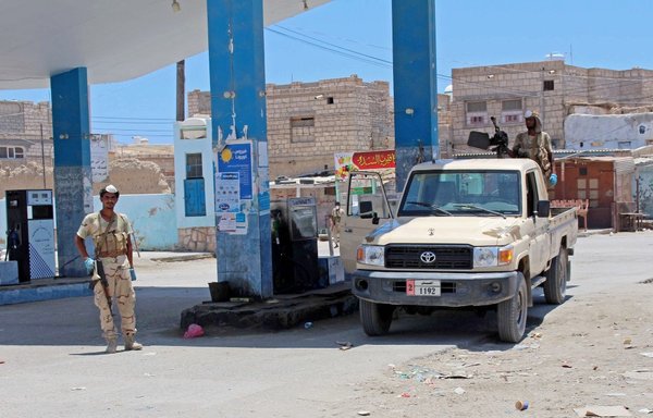 Yemeni pro-government fighters gather at a petrol station in the coastal town of al-Shahr, in the southern Yemeni province of Hadhramaut, where the first case of coronavirus was reported on April 10th. [AFP]