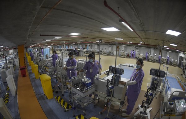 Medical staff are seen in the newly-inaugurated intensive care unit for COVID-19 patients at the Bahrain Defense Force Hospital in Riffa, near the capital Manama, on April 14th. [Mazen Mahdi/AFP]