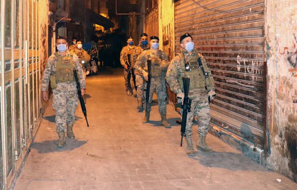 Lebanese forces patrol the streets wearing protective masks and gloves. [Photo courtesy of Lebanese Army Command, Directorate of Guidance]
