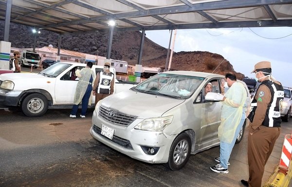 A medical and security checkpoint inspects motorists entering Riyadh to verify they left their homes out of necessity or have permission to move around. [Photo courtesy of Saudi Press Agency]