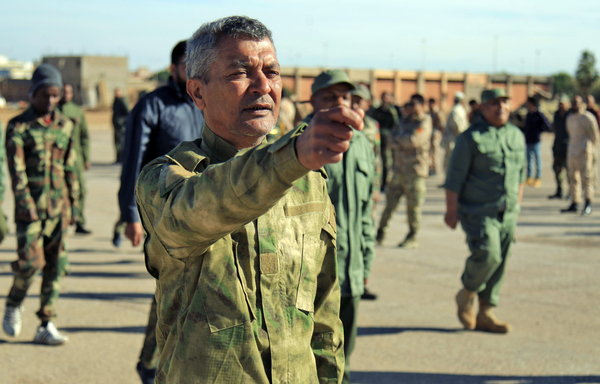 Members of a military battalion loyal to Libyan General Khalifa Haftar are shown in Benghazi last December. [Abdullah Doma/AFP]