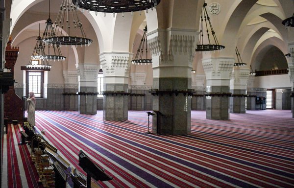 Imam Mohammed, muezzin of the Jaffali mosque in Saudi Arabia's Red Sea coastal city of Jeddah, announces the prayer call at the mosque which is closed due to a government decree as part of efforts to combat the coronavirus pandemic, during the holy month of Ramadan on April 28th. [Amer Hilabi/AFP]