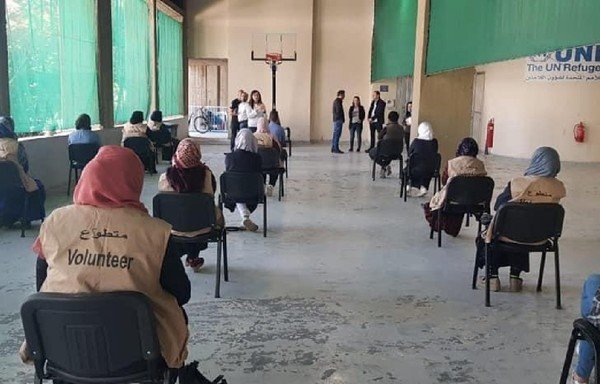 Syrian volunteers participate in a training course on raising awareness about COVID-19 inside the camps in Lebanon. [UNHCR]