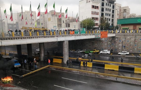 Iranian protestors block a road during a demonstration against an increase in gasoline prices in Tehran, on November 16th, 2019. [AFP]
