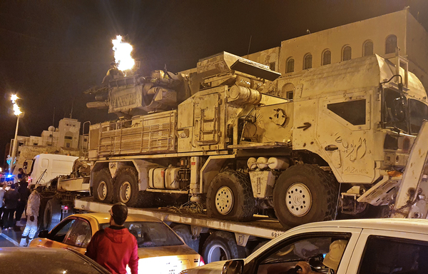 Forces loyal to Libya's UN-recognised Government of National Accord parade a Russian-made Pantsir air defence system truck in Tripoli on May 20th after its capture at al-Watiya airbase (Okba Ibn Nafa airbase) from forces loyal to Libya's eastern-based strongman Khalifa Haftar. [Mahmud Turkia/AFP]