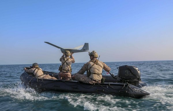 A reconnaissance Marine assigned to the Maritime Raid Force, 26th Marine Expeditionary Unit (MEU), prepares to launch an RQ-20 Puma aboard a combat rubber raiding craft May 24th as part of routine sustainment training in the US 5th Fleet area of operations. [US Marine Corps]