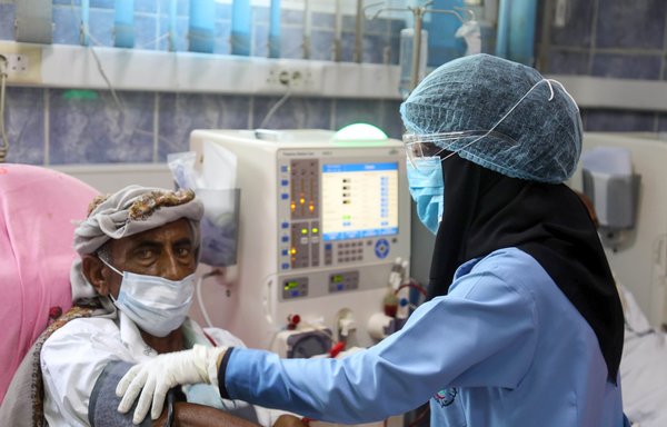 Mask-clad patients, suffering from kidney failure, receive dialysis treatment at al-Thawra hospital in Yemen's third city of Taez, on June 8th. [Ahmad al-Basha/AFP]