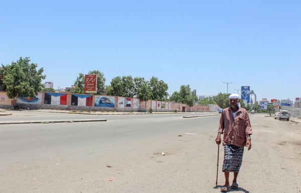 A Yemeni man walks on an empty street in Aden, on April 26th, after the Southern Transitional Council (STC) declared self-rule in the south of the country. [Saleh al-Obeidi/AFP]