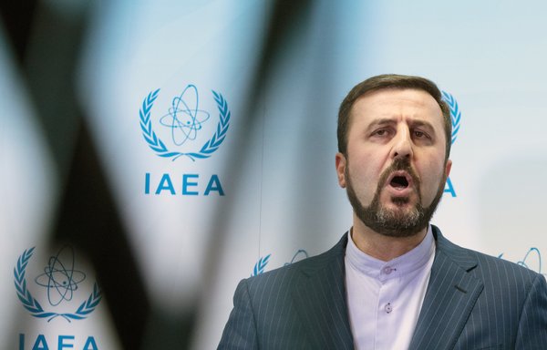 Iran's Permanent Representative to the UN Kazem Gharib Abadi is seen giving a press conference after an International Atomic Energy Agency (IAEA) Board of Governors' meeting in Vienna on July 10th, 2019. [Alex Halada/AFP]