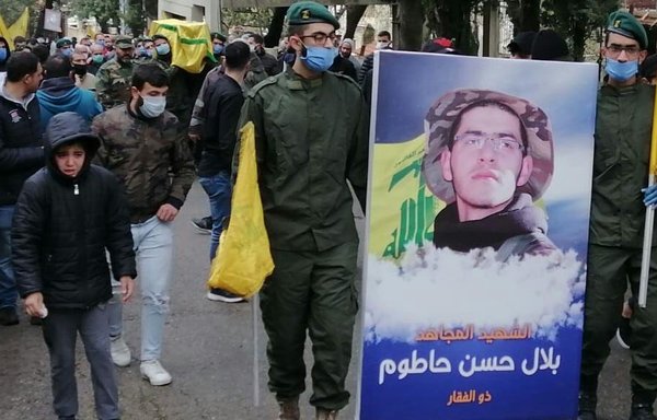 Hizbullah elements are seen during a funeral in April for a member of the militia killed in Syria. [Photo courtesy of Lebanon's Martyrs Foundation]