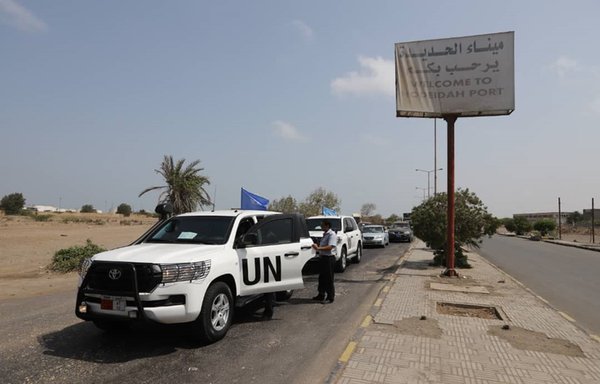 A picture taken May 11th, 2019, in the Red Sea port of al-Hodeidah shows UN vehicles arriving at the entrance of the Saleef port. [AFP]