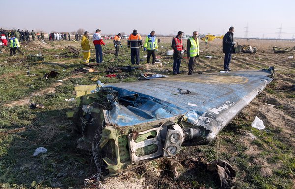In this file photo taken January 8th, 2020, rescue teams are seen at the scene where a Ukrainian airliner crashed shortly after take-off near Imam Khomeini airport in the Iranian capital Tehran. [Akbar Tavakoli/IRNA/AFP]