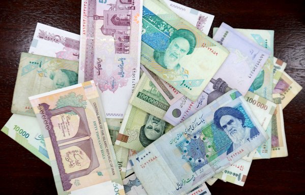 Iranian rials are displayed in Tehran on July 31st, 2019, after the government approved a plan to remove zeros from the rial and rename the currency. [Atta Kenare/AFP]