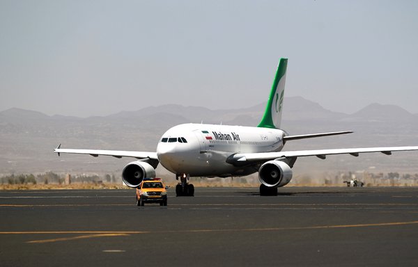 An Airbus A310-304 aircraft of Iranian airliner Mahan Air sits on the tarmac after landing at Sanaa International Airport on March 1st, 2015 a day after officials from the Houthi-controlled city signed an aviation agreement with Tehran. [Mohammed Huwais/AFP]