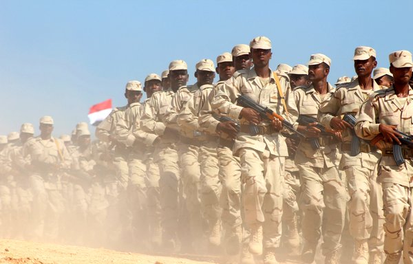 In this file photo taken November 29th, 2018 Yemeni forces parade during a ceremony at al-Mukalla airport. Yemeni separatists on July 29th abandoned their declaration of self-rule in the south and pledged to implement a stalled Saudi-brokered peace agreement with the government. [Saleh al-Obeidi/AFP]