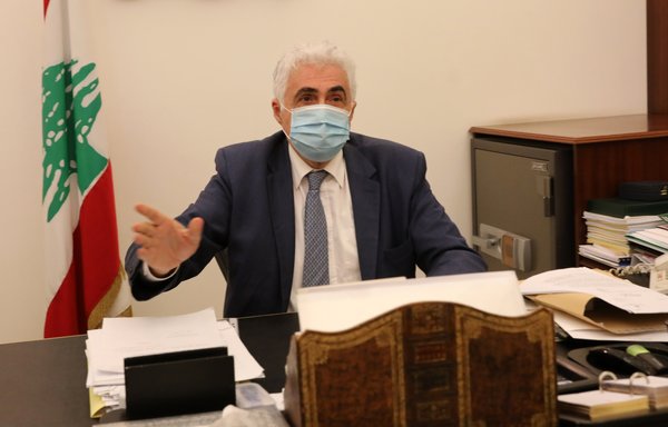 Lebanon's Foreign Minister Nassif Hitti is pictured wearing a face mask due to the coronavirus in his office in Beirut on August 3rd, the day he announced his resignation. [Anwar Amro/AFP]