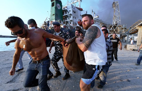 A wounded man is evacuated from a ship following an explosion at the port of Beirut on August 4th. [AFP]