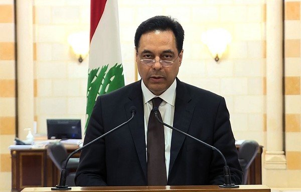 An image grab obtained from Lebanon's public television network Télé Liban on August 10th shows Prime Minister Hassan Diab announcing his government's resignation amid popular outrage over the deadly Beirut port explosion. [Télé Liban/AFP]