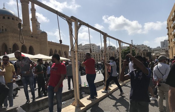 At Martyrs Square in Beirut, demonstrators took part in a 'Day of Judgement' protest on August 8th, to demand the disenfranchisement of the ruling political class and say "No to Hizbullah's weapons". [Nohad Topalian/Al-Mashareq]