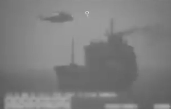 Iranian forces, including two ships and an Iranian 'Sea King' helicopter, on Wednesday (August 12th) overtook and boarded a ship called the 'Wila' in international waters. [Screenshot from a video posted by US Central Command]
