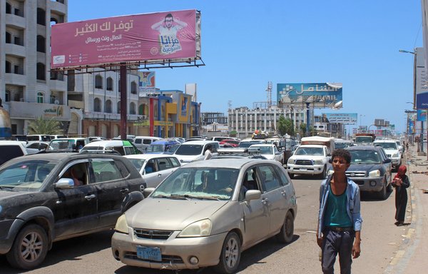 Traffic and pedestrians make their way along a street in Aden on July 29th. [Saleh al-Obeidi/AFP]