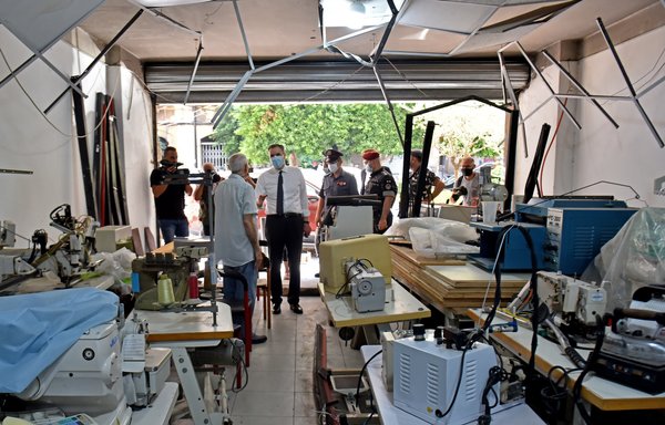 Lebanon's newly-appointed Prime Minister Mustapha Adib speaks with the owner of a damaged shop during a tour in Beirut's badly-hit Gemmayzeh neighbourhood, on August 31st. [AFP]