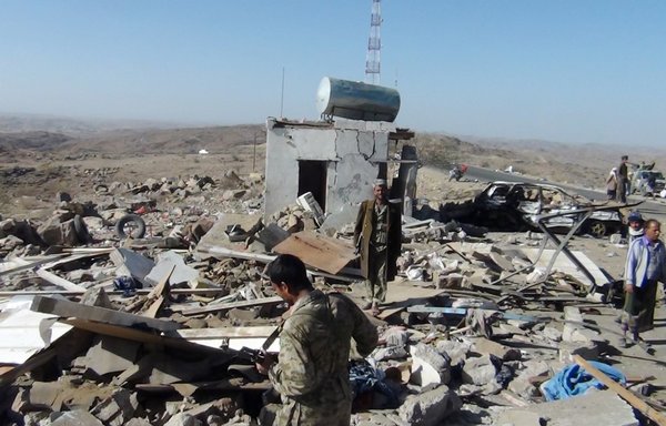 Yemeni soldiers gather at the site of a checkpoint where three policemen were killed in an al-Qaeda suicide attack in al-Bayda province, south of Sanaa, on March 13th, 2012. [AFP]