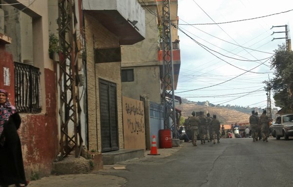 Lebanese soldiers deploy in Ain Qana after an explosion rocked a Hizbullah site in the southern village on September 22nd. [Mahmoud Zayyat/AFP]