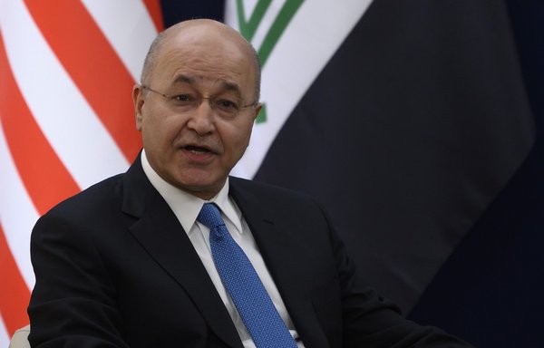 Iraqi President Barham Saleh during a bilateral meeting with US President Donald Trump at the World Economic Forum in Davos, Switzerland, on January 22nd. In his address to the UN General Assembly September 23rd, Saleh voiced concern over 'anarchic' groups who have been launching rocket attacks against US interests in the country. [Jim Watson/AFP]