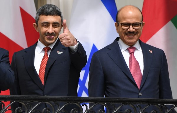 UAE Foreign Minister Abdullah bin Zayed Al-Nahyan (L) and Bahrain Foreign Minister Abdullatif al-Zayani pose before they participate in the signing of the Abraham Accords that normalise ties between their countries and Israel, on the South Lawn of the White House in Washington, D.C., September 15th. [Saul Loeb/AFP]