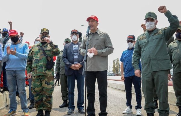 Iranian and Venezuelan officials are seen at a port in Venezuela in an undated photo. [Photo via Mehr News]