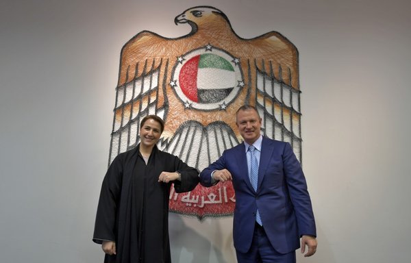 Emirati Minister of State for Food and Water Security Mariam al-Muhairi and Erel Margalit, founder and chairman of Jerusalem Venture Partners, greet each other with an elbow bump on October 27th at the headquarters of the Government Accelerators in Dubai. [Karim Sahib/AFP]