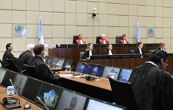 Judge Janet Nosworthy, Presiding Judge David Re and Judge Micheline Braidy (back row, from left) attend a session of the UN-backed Special Tribunal for Lebanon at Leidschendam on August 18th. [Piroschka van de Wouw/ANP/AFP]