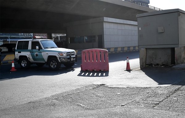 Saudi police close a street leading to a cemetery in Jeddah where a bomb struck a World War I commemoration attended by European diplomats on November 11th, leaving several people wounded. ISIS claimed the attack. [AFP]