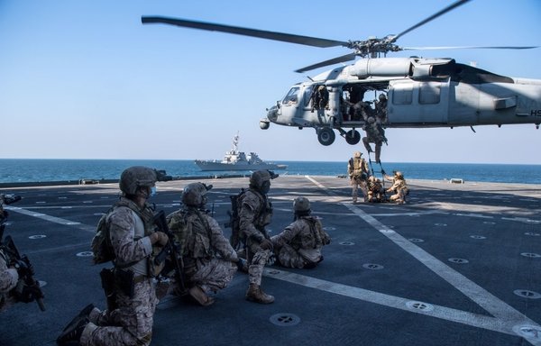 US sailors, marines and coast guard personnel take part in an October 28th training exercise on boarding a ship carrying cargo and ammunition in the Fifth Fleet's area of operation. [CENTCOM]