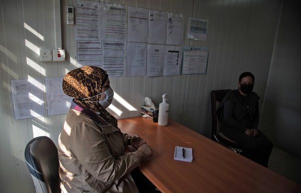 Bayda Othman, a psychologist from Première Urgence, consults a patient at the mental health centre of the Bajet Kandala camp for displaced Yazidis near Dohuk on November 18th. [Florent Vergnes/AFP]