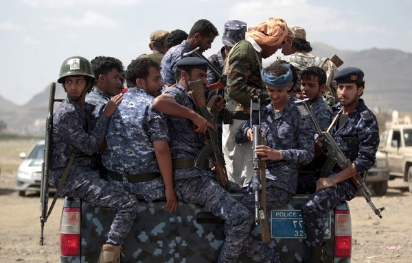 Houthi police forces sit in the back of a military vehicle in Sanaa in this file photo from September 17th, 2019. [Mohammed Huwais/AFP]