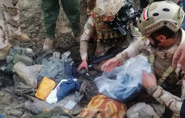 Iraqi soldiers inspect an ISIS hideout in Yathrib, Salaheddine, following a coalition airstrike on December 6th. [Photo courtesy of the Iraqi Ministry of Defence]