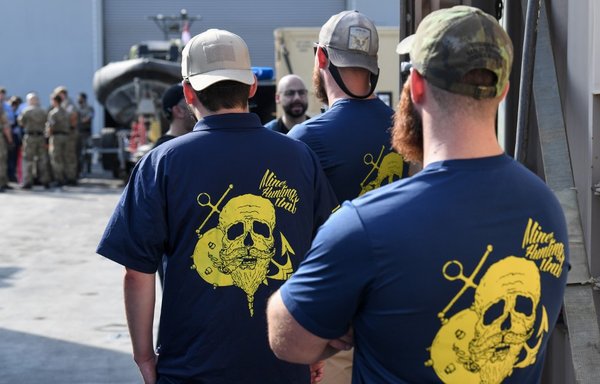 Members of a US mine-hunting unit stand aboard Britain's RFA Cardigan Bay landing ship in the Gulf waters off Bahrain during the International Maritime Exercise on November 5th, 2019. [Karim Sahib/AFP]